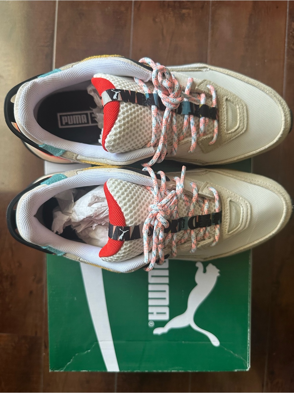 Puma White Sneakers with Red Tongue and Teal Insole Accent